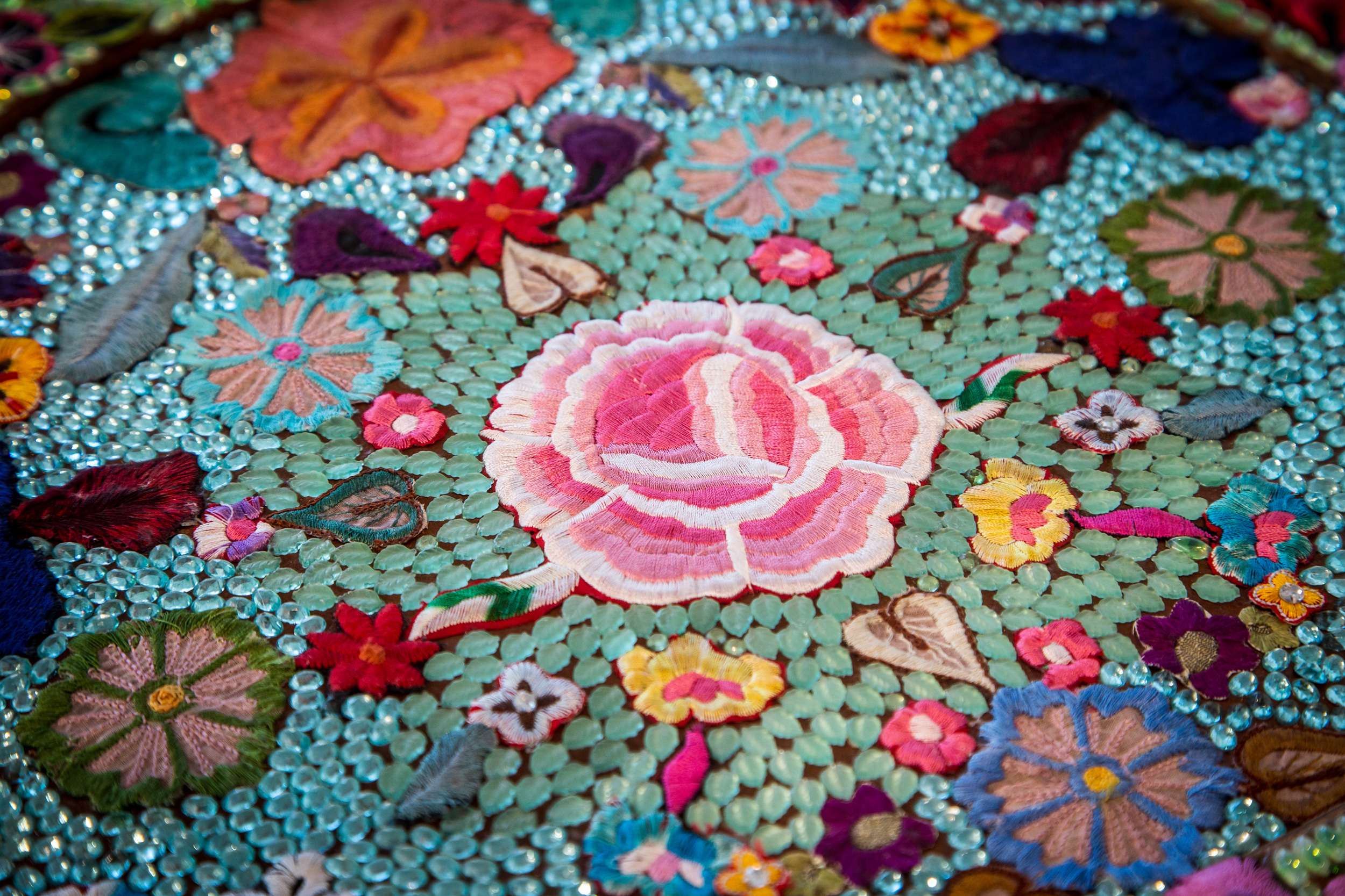 up close photo of sewing and bead work