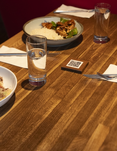 A table with bowls of food and utensils arranged neatly