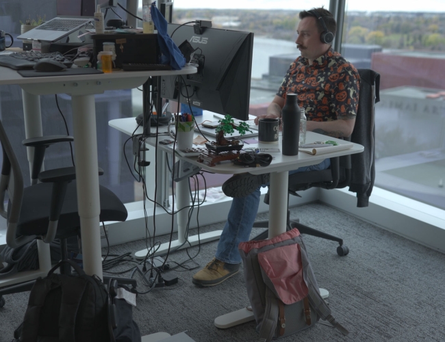 man working at desk and computer at 7 Shifts