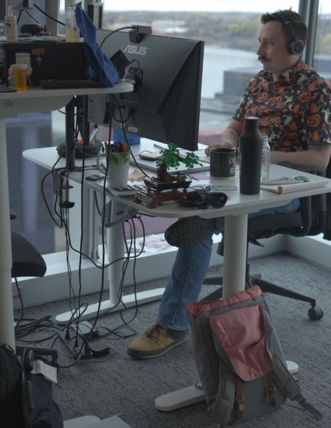 man working at desk and computer at 7 Shifts