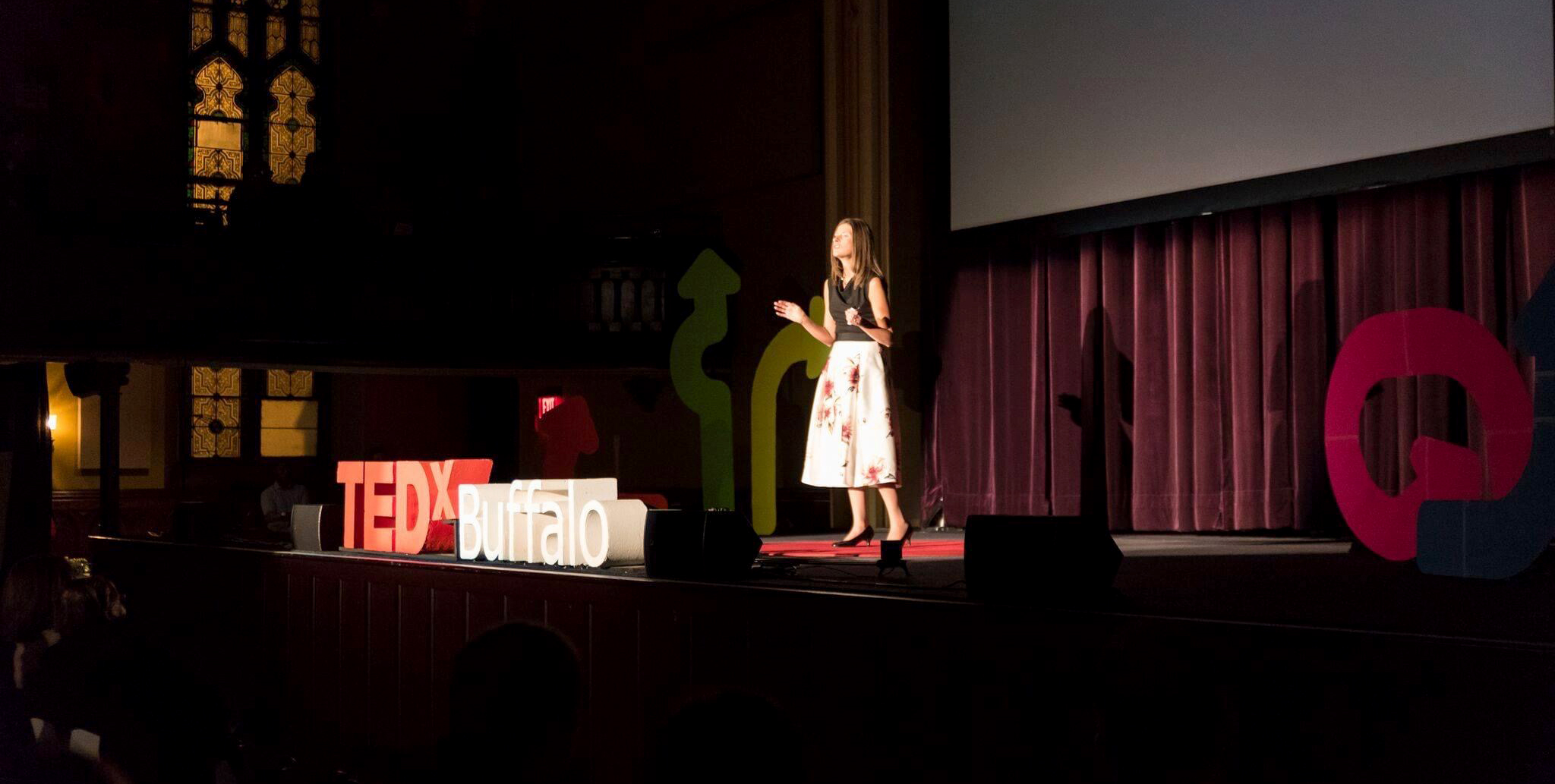 woman on stage at tedx buffalo