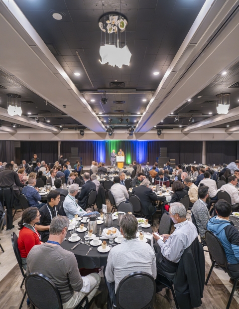 People sitting down at a conference