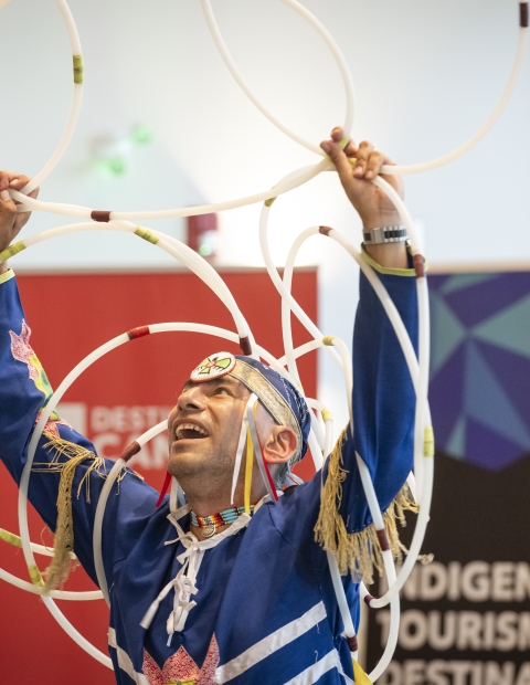 Man holding hula hoop rings