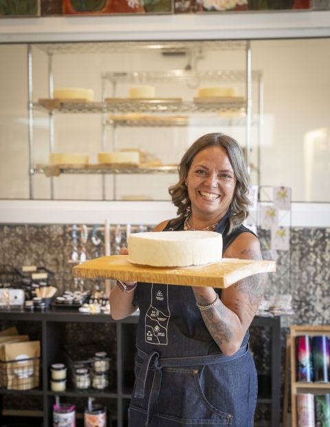 Women holding a cake