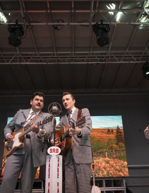 People playing instruments at a concert