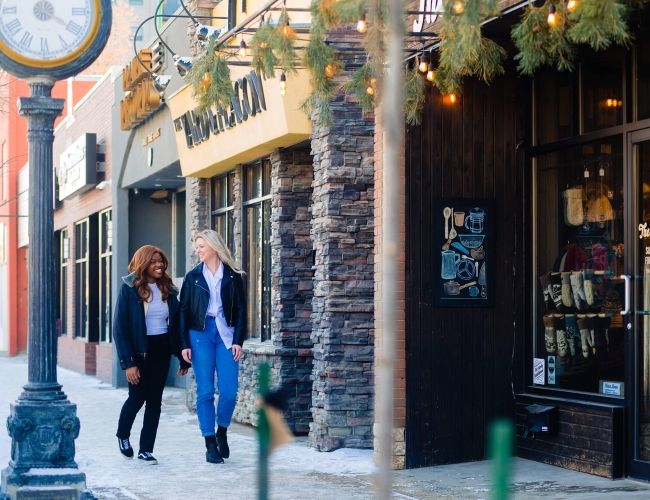 Two women walking down the street.